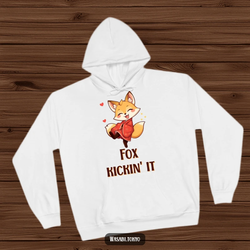Funny fox in a red kimono doing a spirited kick, printed on a warm hoodie, a funny and cozy gift idea.