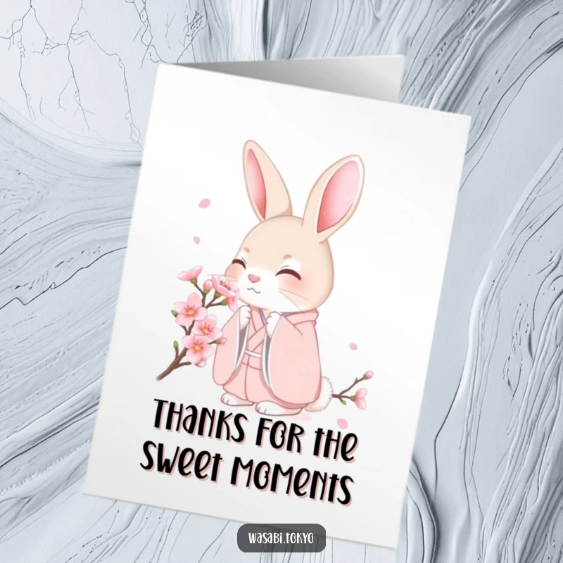 Free Printable Thank You Card: Shy rabbit in a pastel kimono gently smelling a cherry blossom, perfect for expressing thanks.