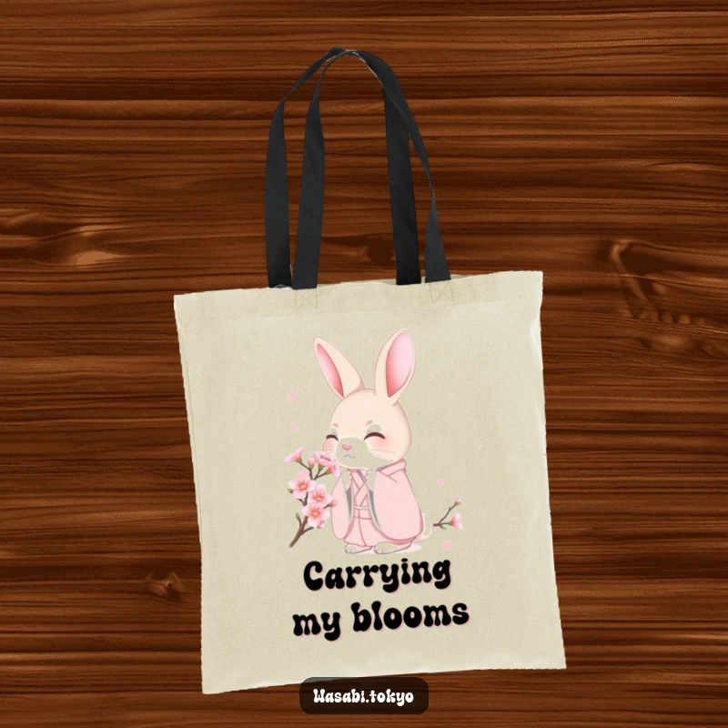 Funny shy rabbit in a pink kimono smelling a cherry blossom on a tote bag, designed for gentle style and humor, a lovely funny gift.